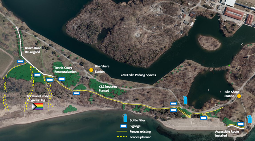 Aerial map of Hanlan’s Point showing completed improvements as of July 1, 2025. From left to right, labelled improvement areas include Beach Road realignment, former tennis courts converted to natural landscape, newly planted trees, bike facilities, water bottle filling stations, and planned fencing.