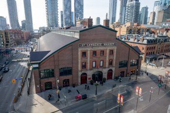 View of the exterior of St. Lawrence Market South. Shot from above facing south.