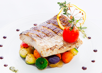 Plated fish and vegetables