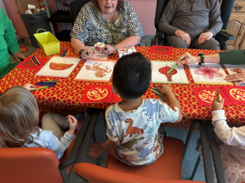 Children participate in arts and crafts as part of Intergenerational programming with seniors.