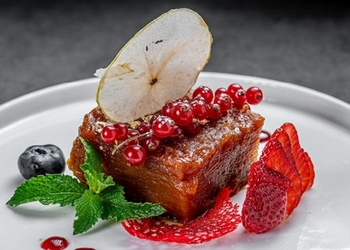 Plated dessert with berries and mint