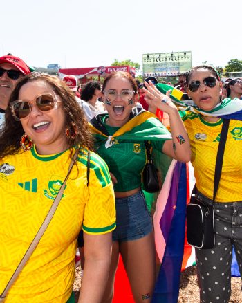three fans enjoying themselves at FIFA Fan Festival
