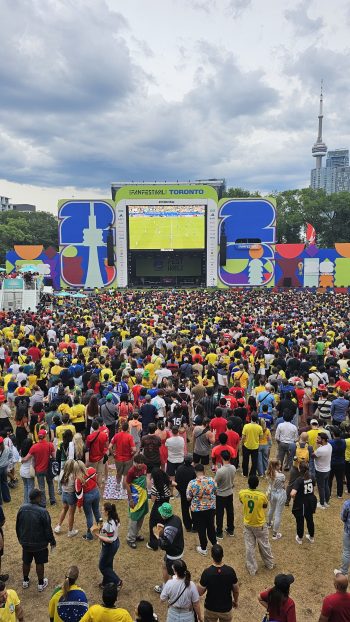 wide shot of FIFA Fan Festival, large crowd of fans