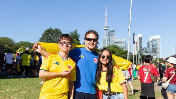 three fans enjoying themselves at FIFA Fan Festival