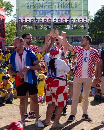 five fans enjoying themselves at FIFA Fan Festival