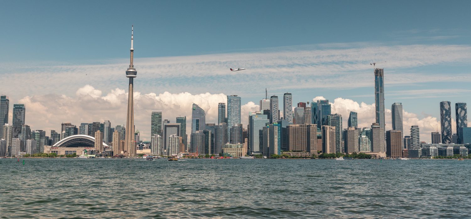 A scenic view of Toronto's downtown skyline over the lake.