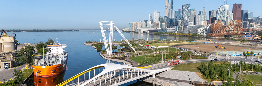 A birds eye view of a bridge over a rive leading out to Toronto's inner harbour