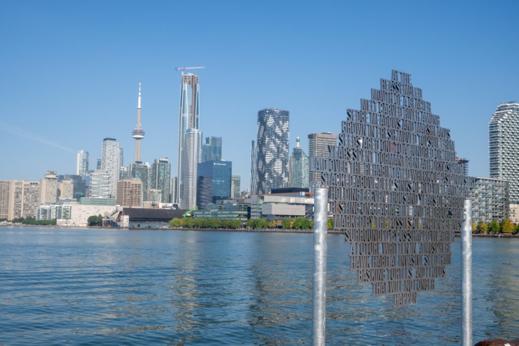 Chrome sculpture “Lodestar” by artist Lisa Hirmer; part of Lassonde Art Trail at Biidaasige Park overlooking Toronto skyline