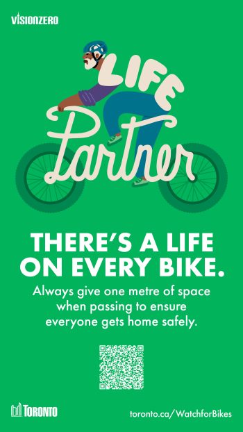 A person on a bike with the words "Life Partner" around them. Text reads, "There's a life on every bike. Always give one metre of space when passing to ensure everyone gets home safely."