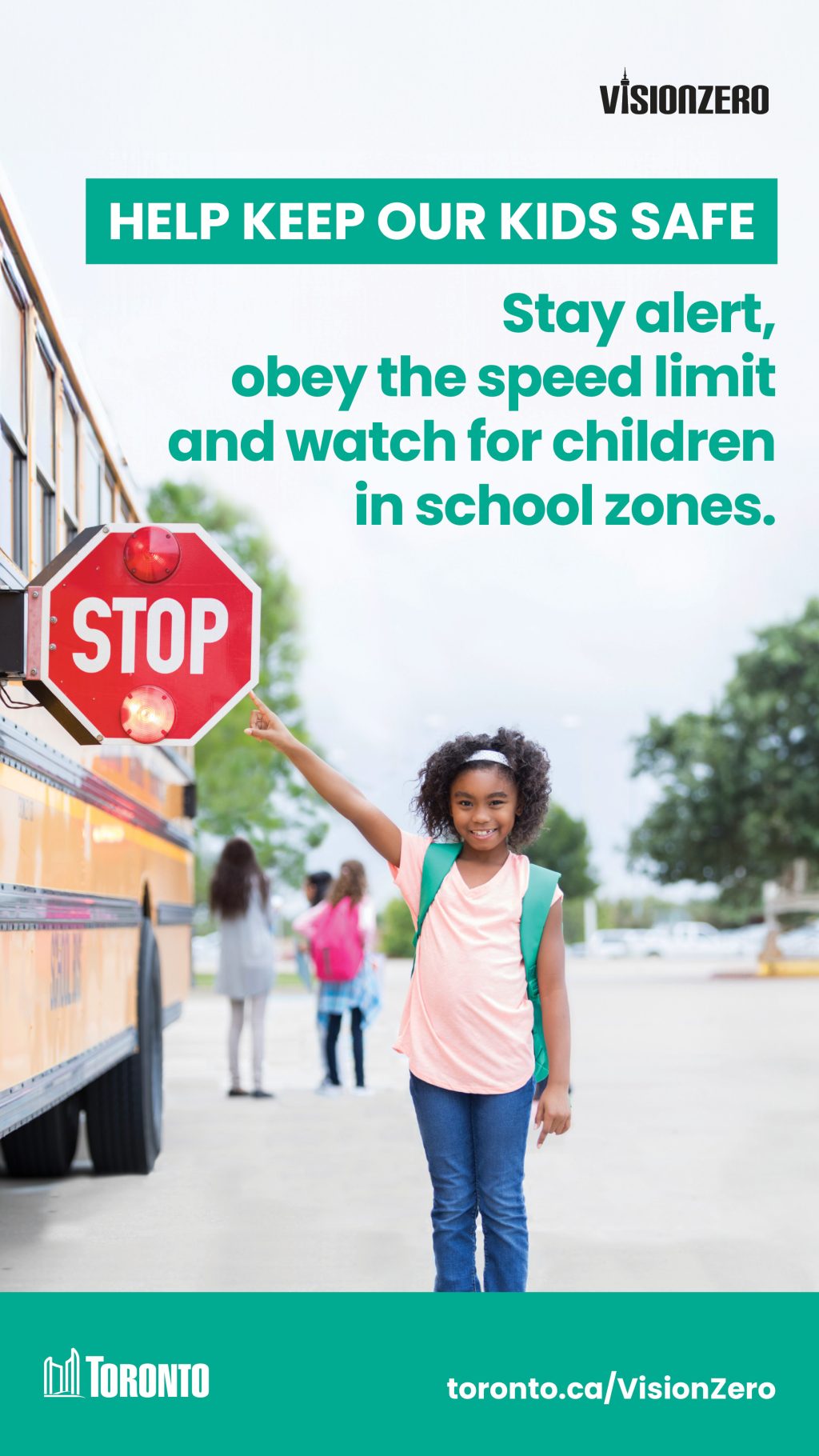 Image of a child pointing to the stop sign on a school bus