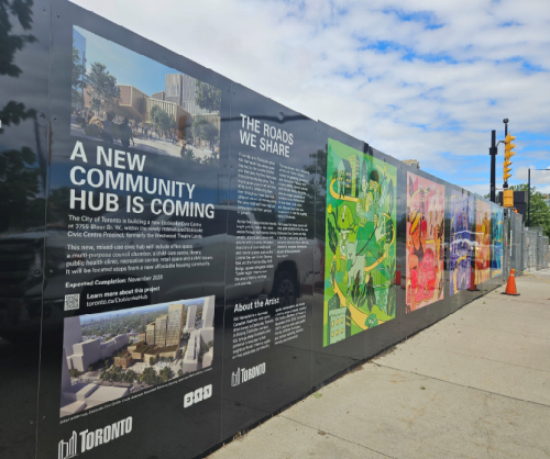billboard with information on what is being constructed and images of artwork