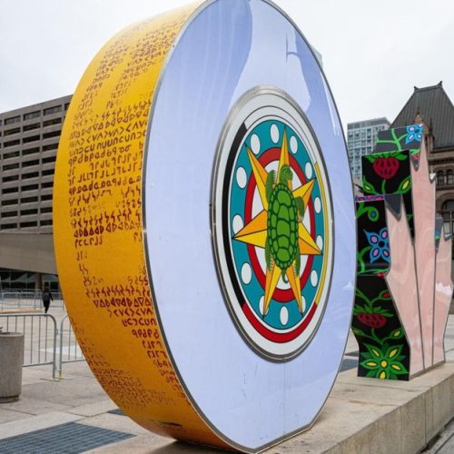 Image of a turtle on the Indigenous Wrap on the Toronto Sign.