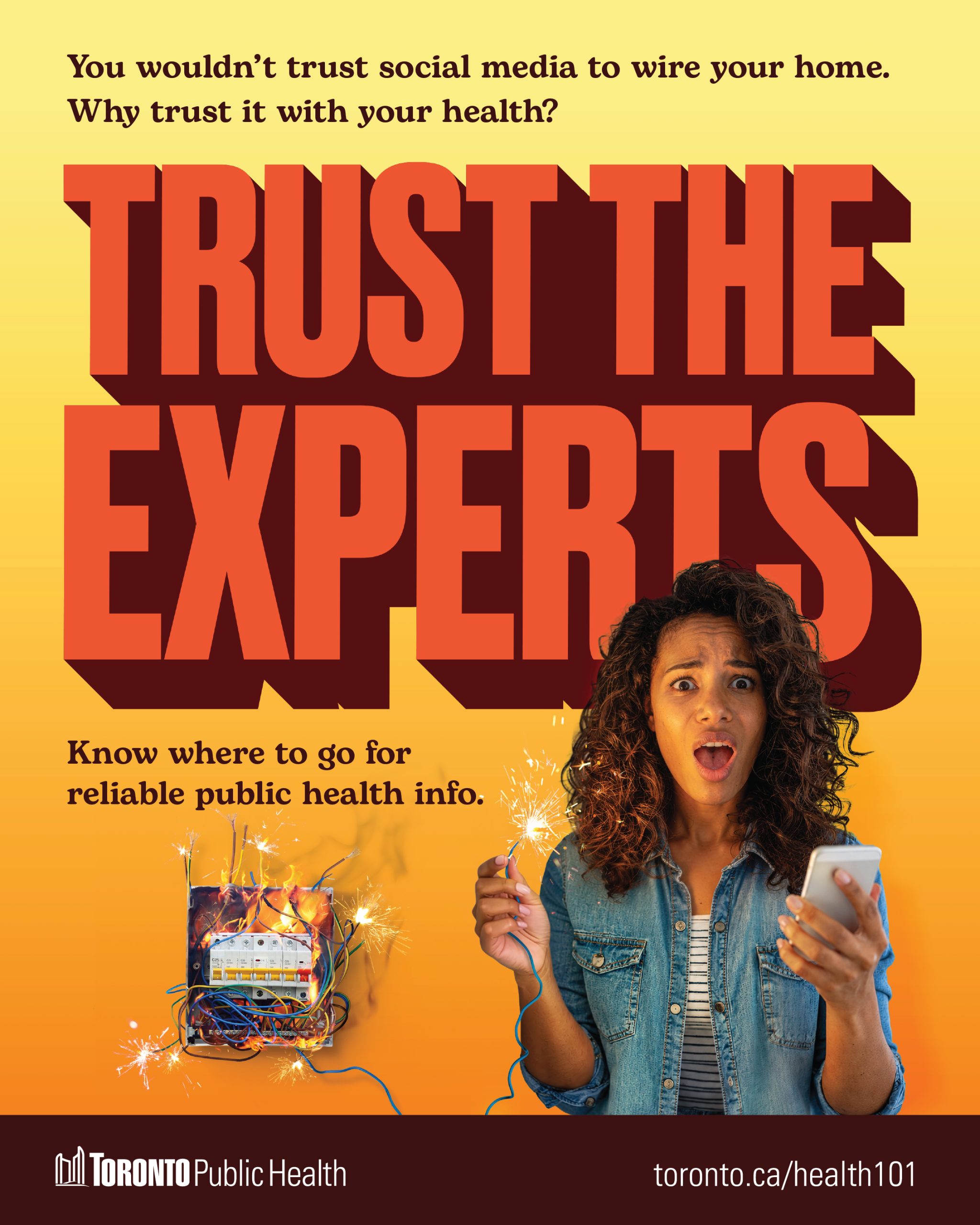 A lady holding the phone in one hand and a wire firing in another hand seems to be scary. The text reads "You wouldn't trust social media to wire your home. Why trust it with your health? Trust the experts. Know where to go for reliable public health info".