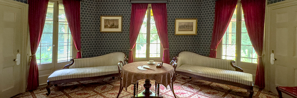 The inside of an historic house living room.