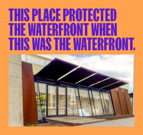 Text this place protected the waterfront when this was the waterfront over image of modern horizontal building with large glass windows