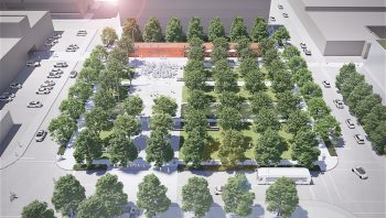 Aerial view of park showing rows of mature tree canopy in a grid-like linear pattern, with the public art at one end and open paved gathering area next to it, taking up about one quarter of the park area. The generous tree canopy frames a welcoming public gathering space. The integrated artwork extends from the pavilion façade into the ground plane, drawing people toward the building and creating a continuous relationship between architecture, landscape and public life.