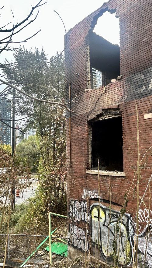 Old brick building post fire ready for demolition.