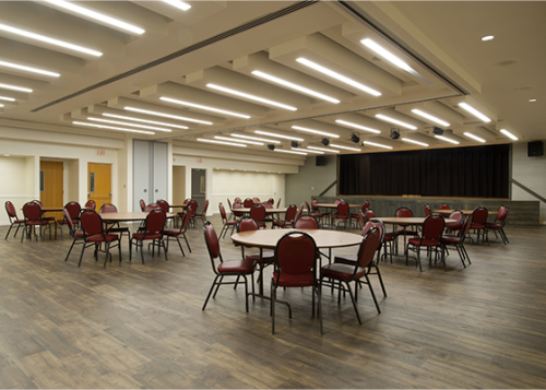 Memorial Hall Burgundy Room with a round tables setup throughout the room