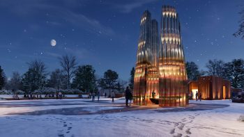 Rendering of the public art described in the text below this image. Winter evening view of the illuminated hearth pavilion, where visitors gather around a sheltered fire feature within the park's central plaza.