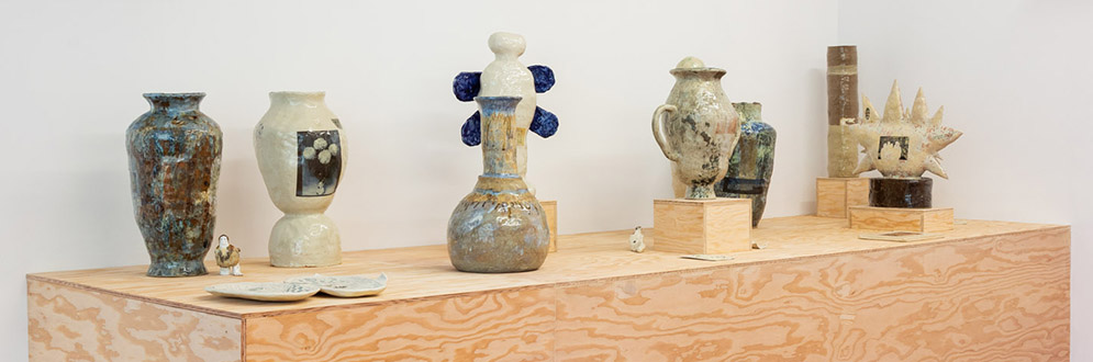 Fired clay vessels in a variety of shapes, some with protruding knobs